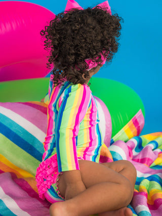 RuffleButts + RuggedButts - Baby Girls Neon Rainbow Stripe Long Sleeve One Piece Rash Guard Swimsuit with Signature Rear Ruffles