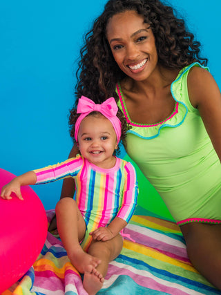 RuffleButts + RuggedButts - Baby Girls Neon Rainbow Stripe Long Sleeve One Piece Rash Guard Swimsuit with Signature Rear Ruffles