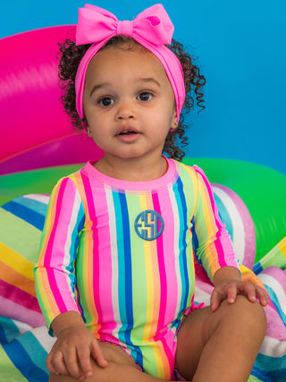 RuffleButts + RuggedButts - Baby Girls Neon Rainbow Stripe Long Sleeve One Piece Rash Guard Swimsuit with Signature Rear Ruffles
