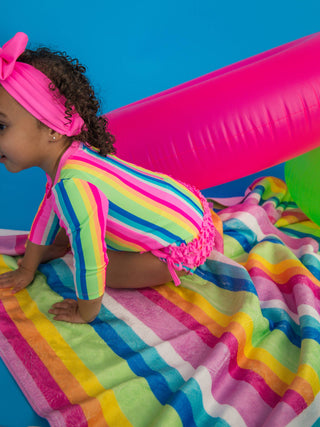 RuffleButts + RuggedButts - Baby Girls Neon Rainbow Stripe Long Sleeve One Piece Rash Guard Swimsuit with Signature Rear Ruffles