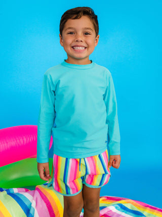 RuffleButts + RuggedButts - Boys Neon Rainbow Stripe Performance Hybrid Dolphin Hem Swim Trunks