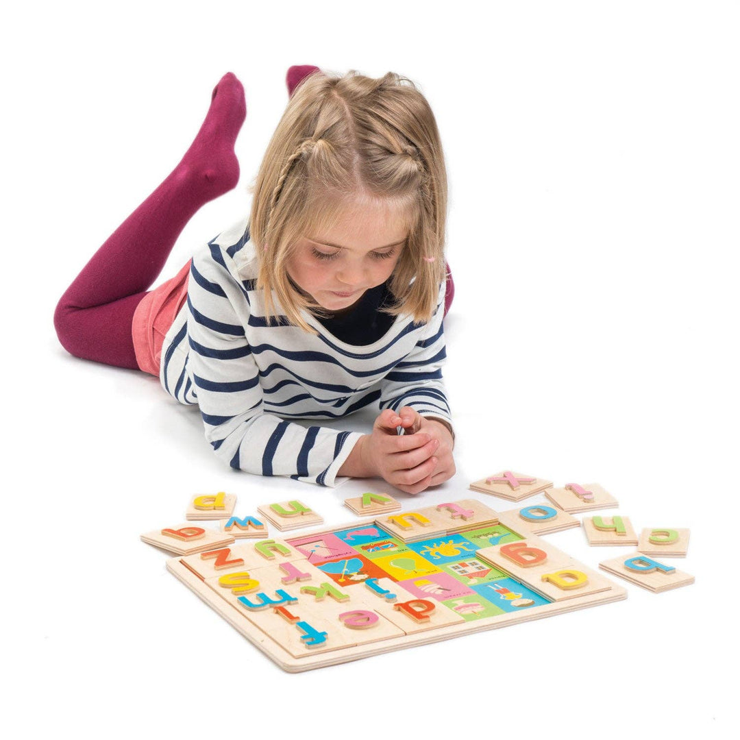 Girl Playing with Wooden Alphabet Puzzle