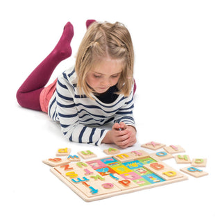 Girl Playing with Wooden Alphabet Puzzle