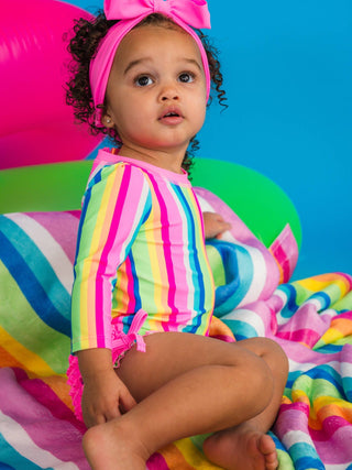 RuffleButts + RuggedButts - RuffleButts + RuggedButts - Baby Girls Neon Rainbow Stripe Long Sleeve One Piece Rash Guard Swimsuit with Signature Rear Ruffles - Classy Rascals Boutique