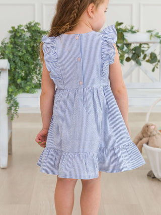 RuffleButts + RuggedButts - RuffleButts + RuggedButts - Girls Blue Seersucker Pinafore Bow Dress - Classy Rascals Boutique