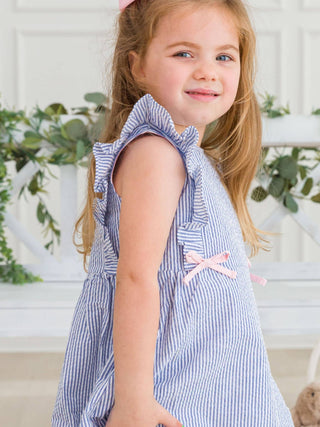 RuffleButts + RuggedButts - RuffleButts + RuggedButts - Girls Blue Seersucker Pinafore Bow Dress - Classy Rascals Boutique
